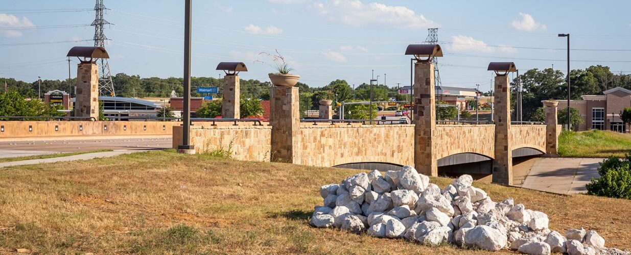 Glade Parks Blvd Bridge ground level view with white rocks